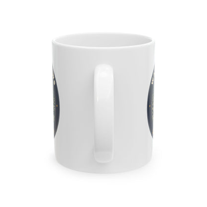 Warm Windows, Snowy Pines 11oz white mug with a glowing cabin among snowy pines, handle view